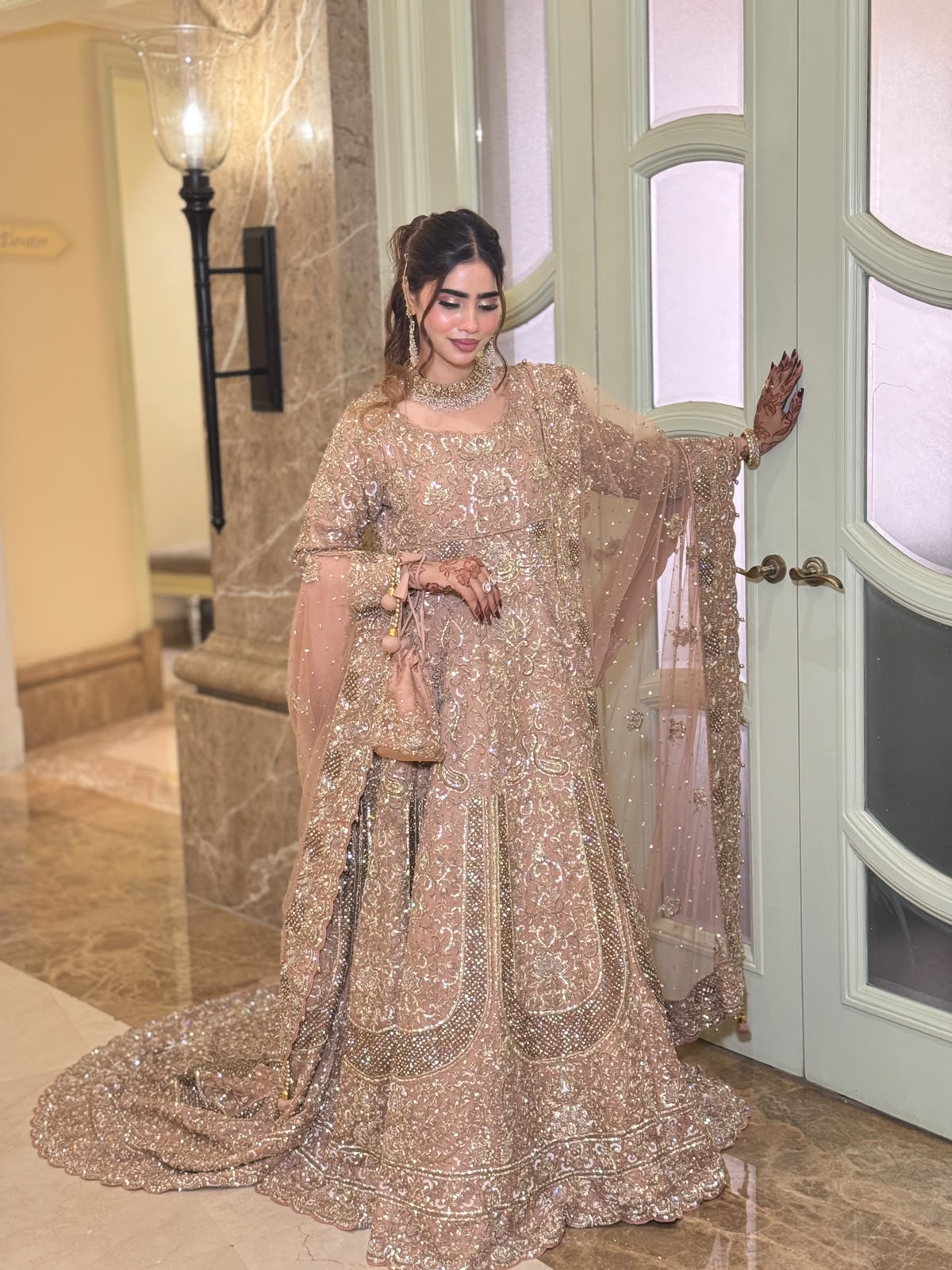 KANZARA Rukhsar rose gold bridal lehenga with pearl and sequin work and long train