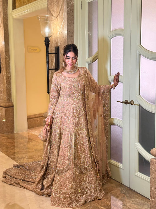 Full view of the KANZARA Rukhsar rose gold bridal lehenga with pearl-edged dupatta